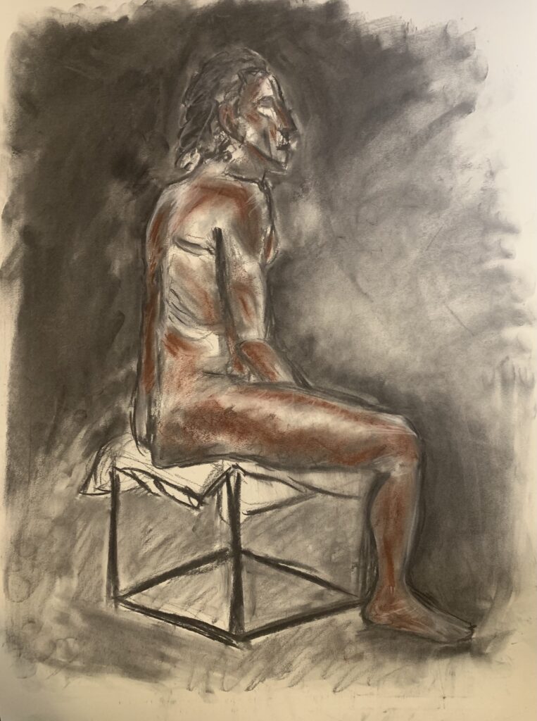 Charcoal and pastel drawing of a man sitting in orange and greyscale tones